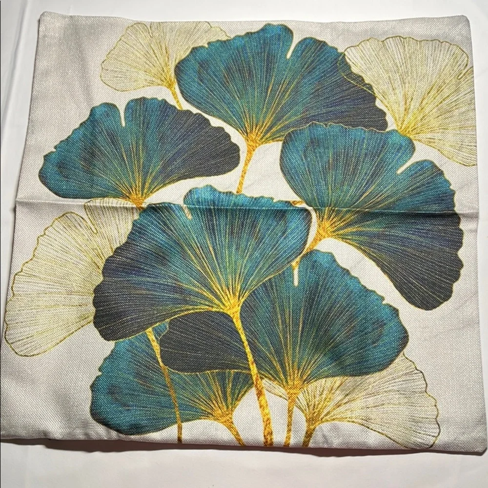 Floral Patterned outdoor waterproof throw pillow with Blue and Yellow Leaves.